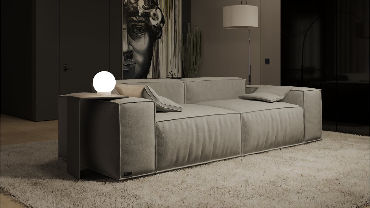 Лофт-стиль гостиная: просторный серый диван, ковер с длинным ворсом, минималистичный настольный светильник, большой арт-объект на стене, элегантный пол настольной лампы.